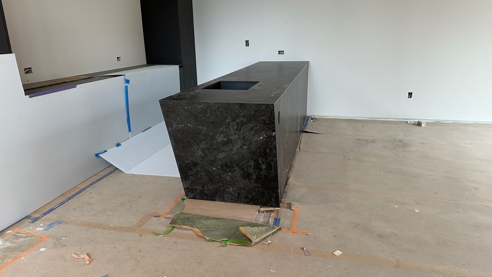 Mitered porcelain island edge built up from a single slab, fabricated by Custom Touch Granite