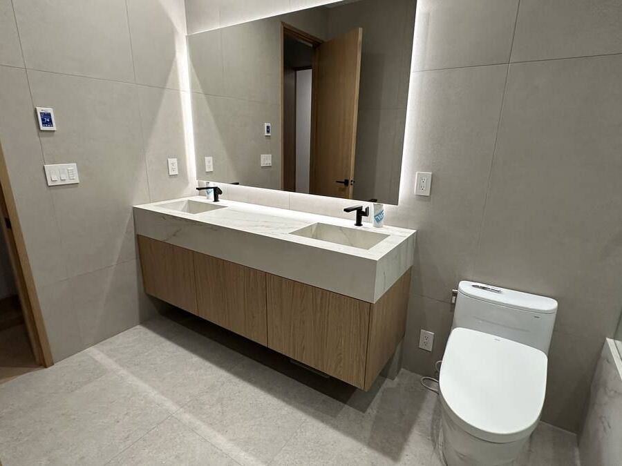 Dekton porcelain mitered vanity with custom integrated sinks, Clyde Hill WA