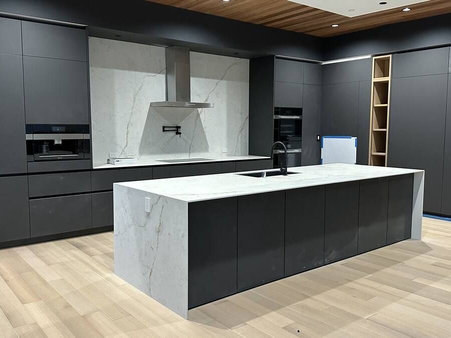 Dekton porcelain kitchen with mitered island and double waterfall legs, Mercer Island WA
