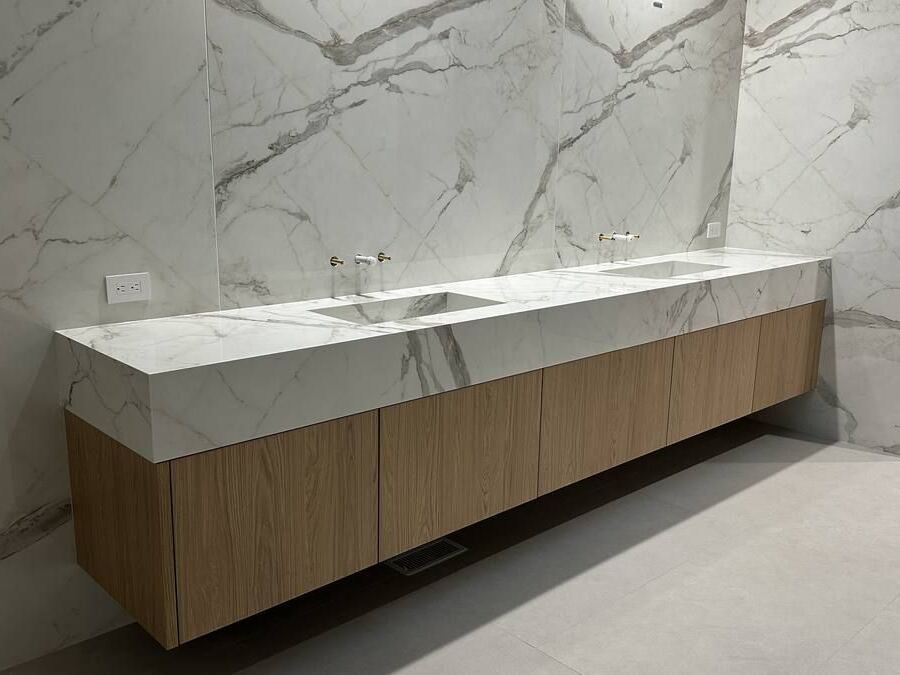 Dekton porcelain wall cladding and mitered vanity with integrated sinks, Clyde Hill WA