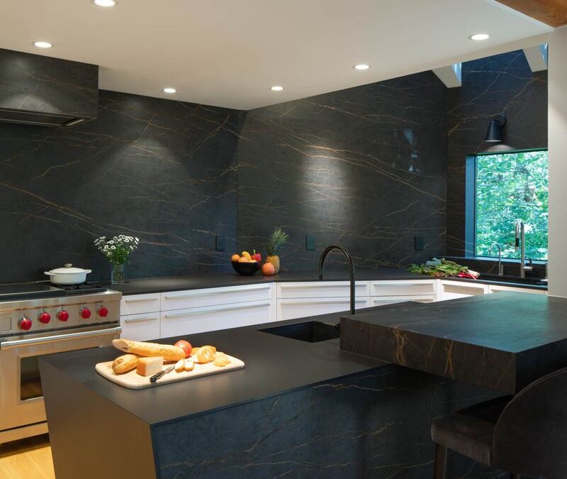 Inalco porcelain island end with a seating overhang, fabricated by Custom Touch Granite
