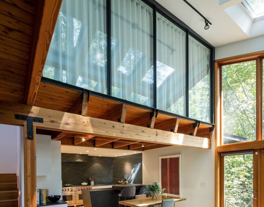 Inalco porcelain kitchen and island seen from the mezzanine above, fabricated by Custom Touch Granite