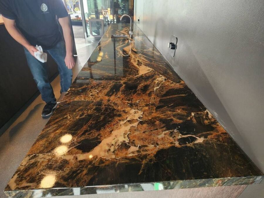 Applying an additional sealing coat to quartzite, Downtown Seattle high-rise