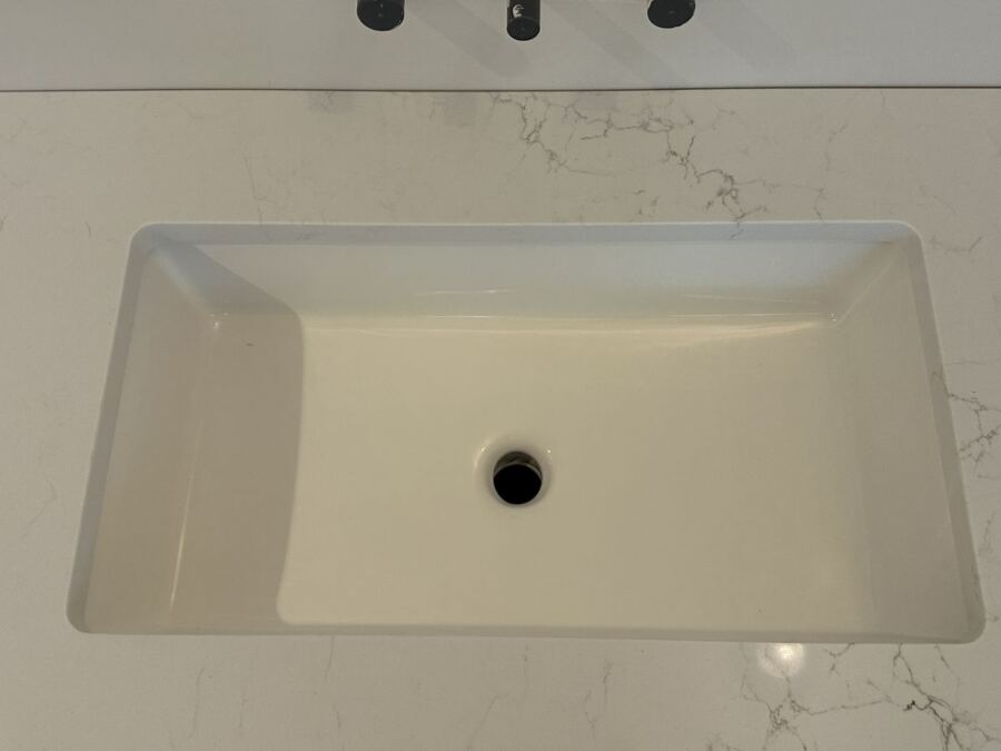 Undermount sink in a white quartz counter